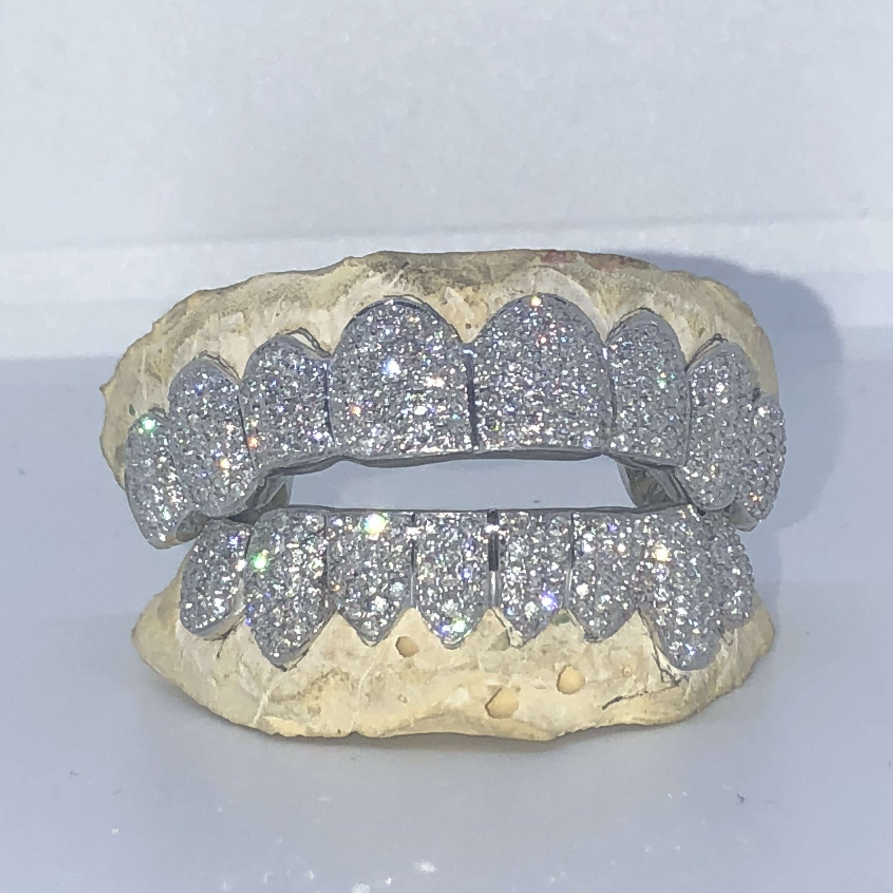 Real white sale gold diamond grillz